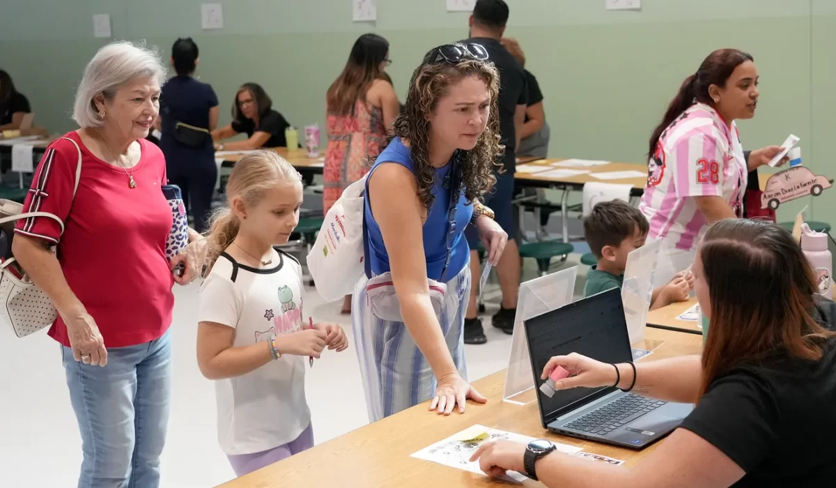 Student, Camila Reina along with her grandmother Aura Velarde, far left, and mom Fabiana Ramsour attend the Dreamers Academy open house on Wednesday, August 6, 2025. Reina, 8, going into the 3rd grade says her favorite classes are science and reading. Dreamers Academy is a dual-language public charter school located in north Sarasota that opened in 2021. Continuing it's expansion, the school is projected to have 1,200 students by the year 2028 with grades K‑8. For more information visit dreamersacademy.org
— Thomas Bender/Sarasota Herald-Tribune