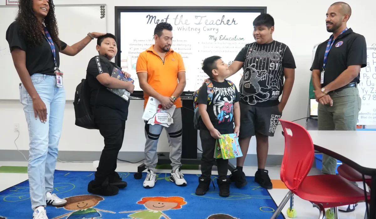 Fourth grade teachers, Miss Whitney Curry and Mr. Diego Velasco, far right, new director of extended and after school programs, with 4th grader Alvin Perez, 10, dad Genaro Perez, 1st grader Gustavo Perez, 7, and 8th grader, Damian Perez, 13, who will be attending Booker Middle School, meet during a Dreamers Academy open house on Wednesday, August 6, 2025. Dreamers Academy is a dual-language public charter school located in north Sarasota that opened in 2021. Continuing it's expansion, the school is projected to have 1,200 students by the year 2028 with grades K‑8. For more information visit dreamersacademy.org
— Thomas Bender/Sarasota Herald-Tribune