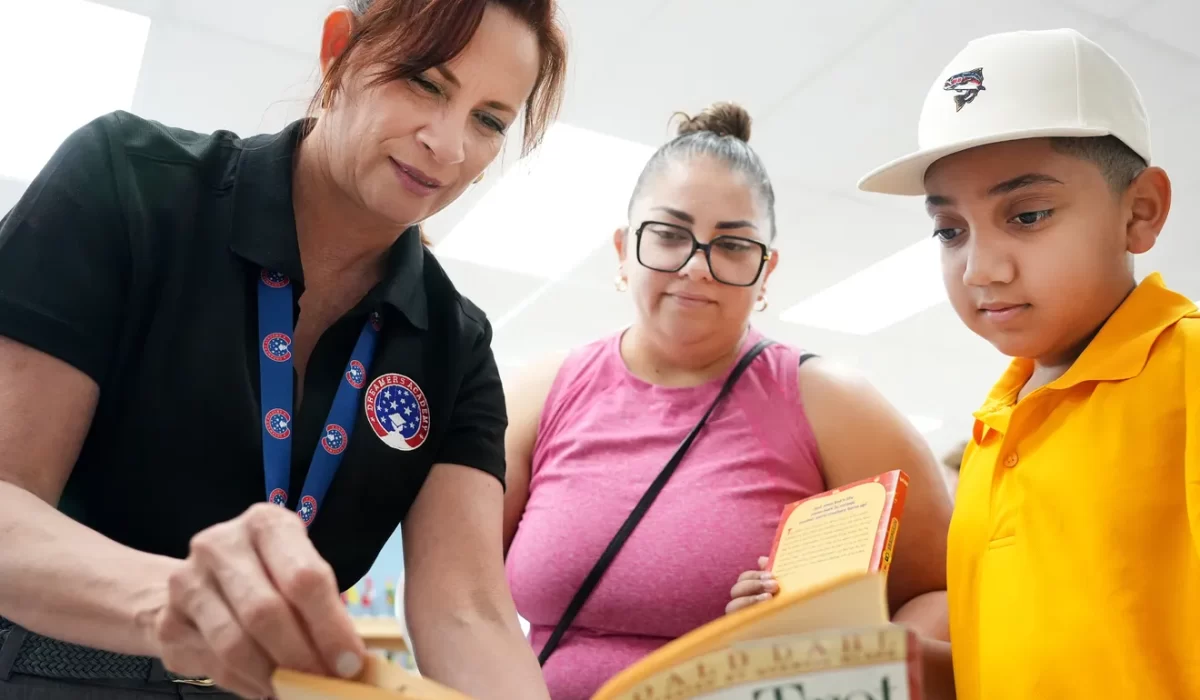Mom, Susana Martinez, of Port Charlotte, looks on with her son Joshua Alexis, 9, going into 4th grade, picking out a book to read, as as librarian Dr Carolina Rivero assist during the Dreamers Academy open house on Wednesday, August 6, 2025. Dreamers Academy is a dual-language public charter school located in north Sarasota that opened in 2021. Continuing it's expansion, the school is projected to have 1,200 students by the year 2028 with grades K‑8. For more information visit dreamersacademy.org
— Thomas Bender/Sarasota Herald-Tribune